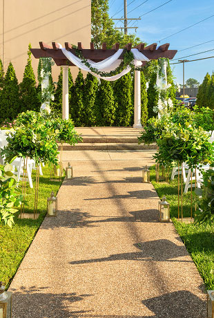 event_type_bkg_2 Beautiful outdoor gazebo at The Mirage decorated with white chiffon and fresh greenery, perfect for elegant wedding ceremonies