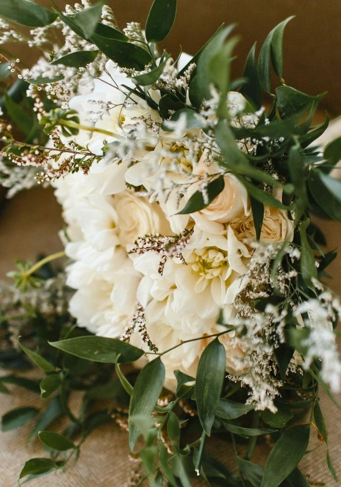 Fresh bridal bouquet for Nikkah decor in Metro Detroit — white dahlias and eucalyptus by Bridal Insignia Events