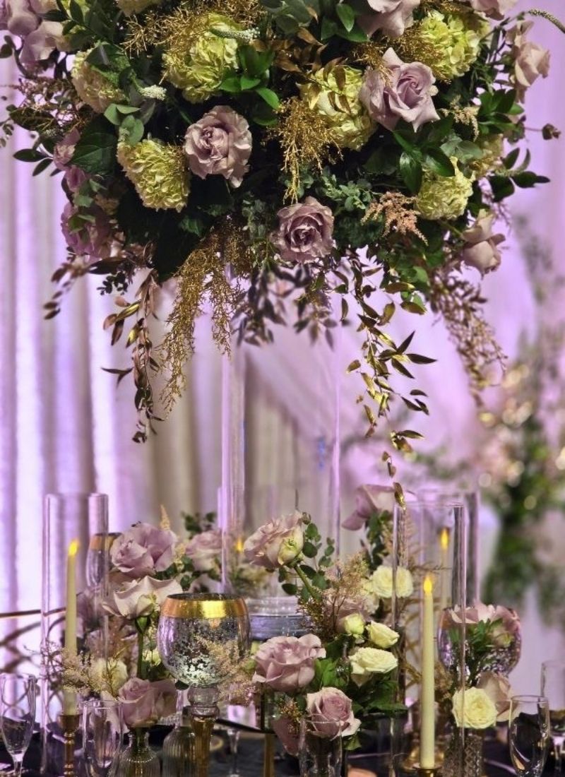 Blush & gold tall arrangement: A towering fresh flower centerpiece featuring dusty rose roses, green hydrangeas, and cascading eucalyptus — exactly the kind of living artistry we bring to fresh flowers for weddings in Metro Detroit.