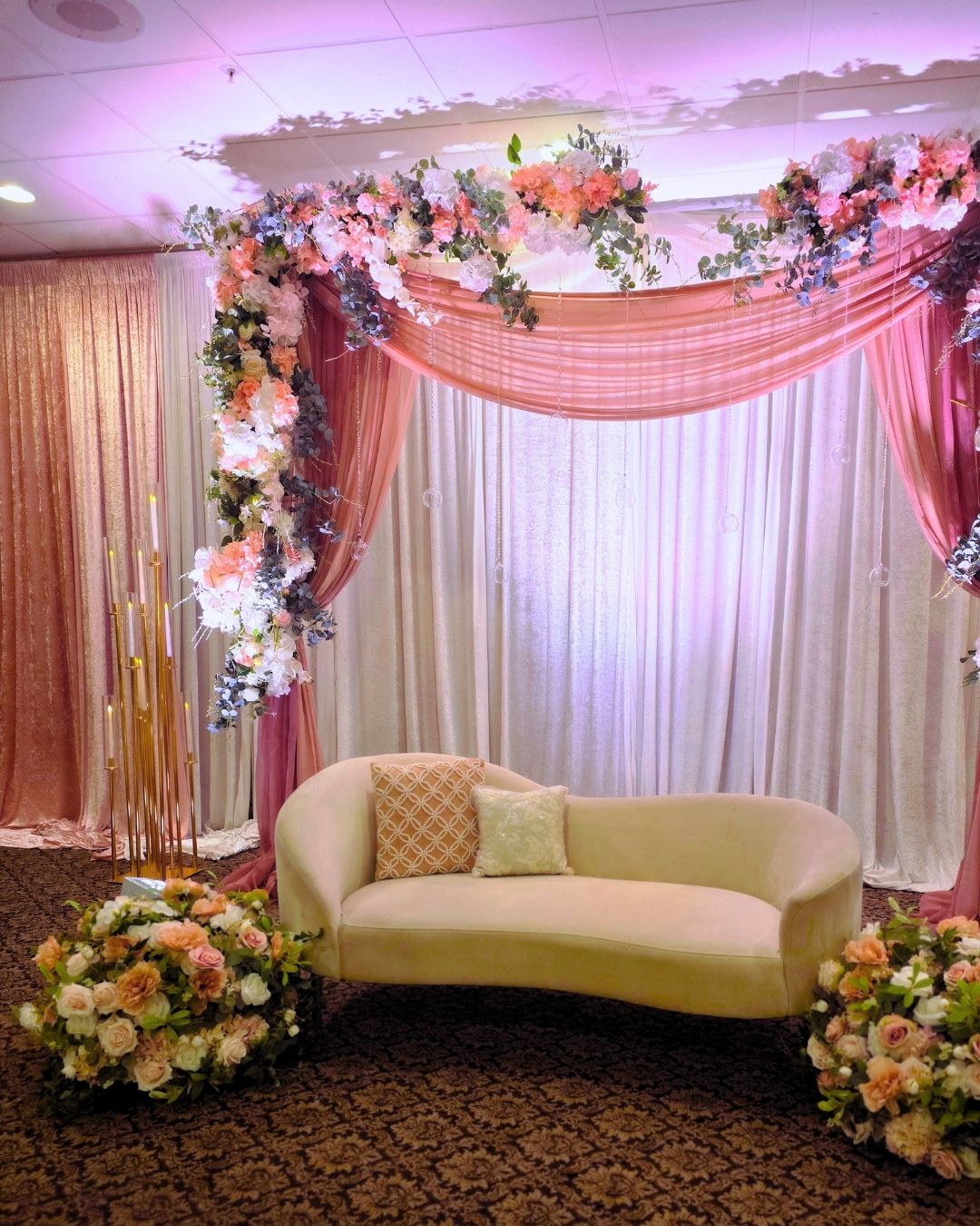 Premium ceiling draping and crystal chandelier lighting for Quinceanera decor in Metro Detroit.