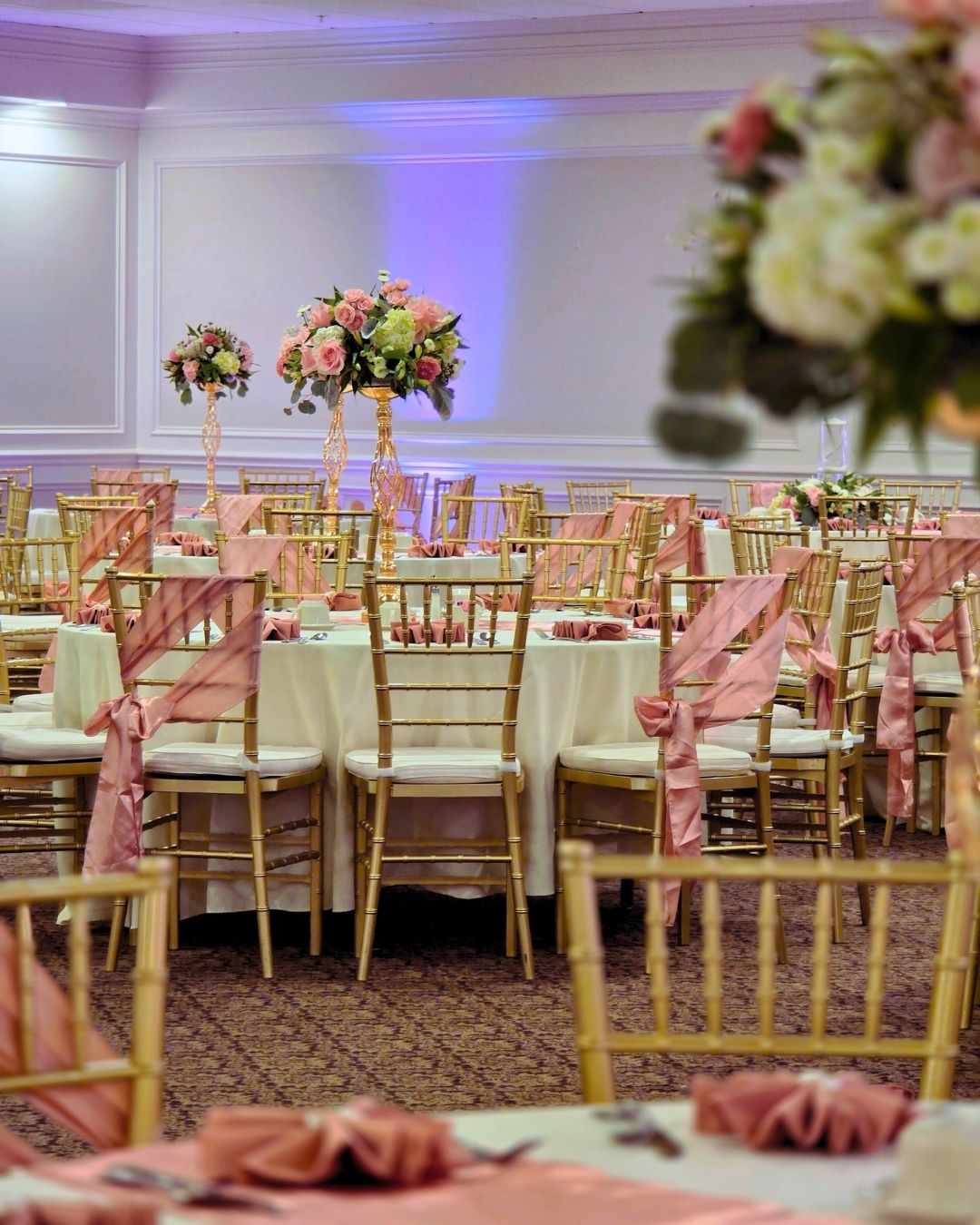 Grand entrance floral archway showcasing custom Quinceanera decor in Metro Detroit.