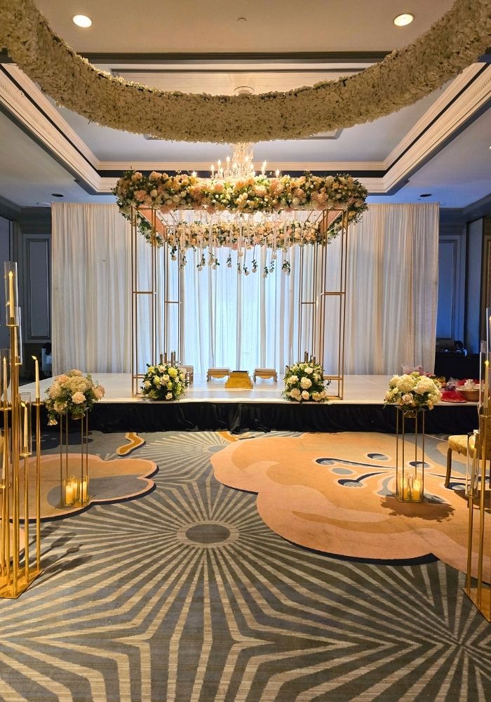 Mandap decorator in Metro Detroit — modern gold frame Mandap with fresh floral canopy by Bridal Insignia Events