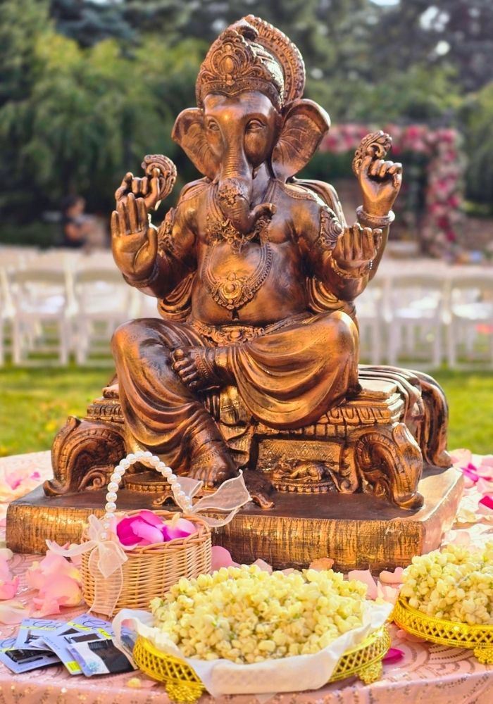 Mandap decorator in Metro Detroit — Ganesh setup with fresh floral offerings by Bridal Insignia Events